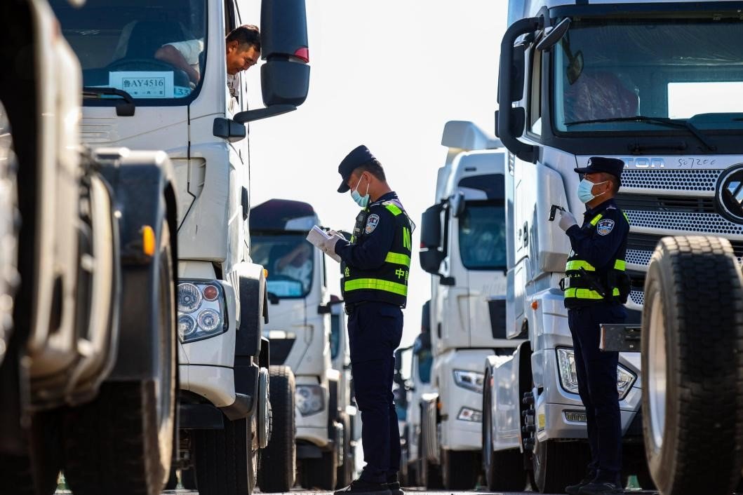 Trucks and freight trains operating at Xinjiang border ports symbolizing China’s westward trade expansion