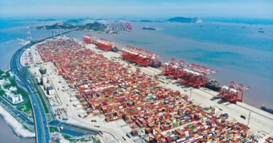 By Han Xin, People's Daily On Xiaoyangshan Island, off Shanghai's southeastern coast, the port hums with nonstop activity. Giant vessels rest alongside the berths. Quay cranes tower overhead. Hundreds of automated guided vehicles (AGVs) move seamlessly between the yard and the shore, sorting and stacking multicolored containers. The entire operation runs with smooth precision -- with barely a human in sight. This is the phase IV automated terminal of Shanghai Yangshan Deep Water Port, the world's largest single-unit automated container terminal. Since it opened in December 2017, the terminal has repeatedly set global records for operational efficiency. At its peak, a single crane has handled over 60 container moves per hour, making it one of the most productive terminals in the world. What gives this port the world's fastest handling speed? The answer lies in its digital brain. In a remote-control operations room, the terminal's digital twin system is on full display. The entire port -- from massive ocean-going vessels down to individual containers -- is mirrored across a wall of digital screens, updated in real time. "Powered by our independently developed intelligent terminal production management and control system, we have achieved unified, end-to-end scheduling of 29 quay cranes, 121 rail-mounted gantry cranes, and 155 AGVs," said Wu Jilin, head of technological innovation at the Shandong Branch of Shanghai International Port Group, which manages and operates the terminal. "This has increased waterfront loading and unloading efficiency and overall yard capacity by about 30 percent compared to traditional operations." The terminal's "mechanical limbs" are equally agile. From the waterfront crew room, twin-lift quay cranes can be seen steadily lifting containers from ships and placing them onto AGVs, which then carry the containers to the yard, where rail-mounted gantry cranes stack them in designated positions. The smoothness of these movements depends on a pair of "nimble hands" located far away. Using the world's first remote-control technology for large-scale cargo-handling equipment based on an F5G all-optical network, crane operators have moved from the driver's cabins at the port to control centers more than 30 kilometers away, and even to remote sites in downtown Shanghai, over 100 kilometers from the terminal. With a simple joystick movement, they maintain precise control. A fully streamlined logistics backbone makes the system even more efficient. Inside a smart heavy-duty truck transport center, a two-level operation space is in view. On the upper level,